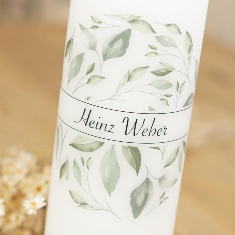 Trauerkerze mit Blättern als Symbol