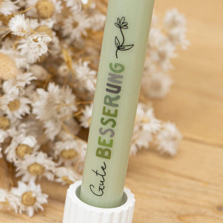 Stabkerze Gute Besserung in Grün mit Blume und Schriftzug