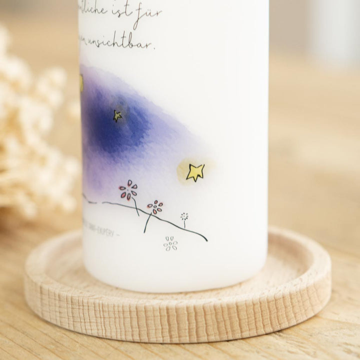 Blumen und Sterne auf der Kerze der kleine Prinz